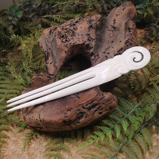 Heru with Koru carved from beef bone