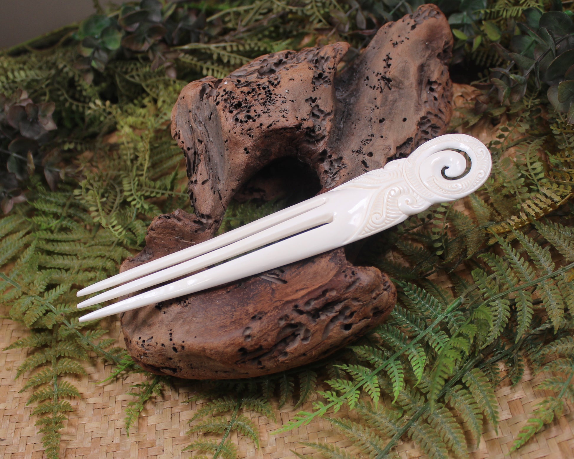 Heru with Koru carved from beef bone