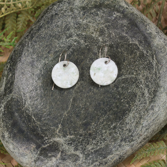 Porowhita earrings carved from Grossular Garnet