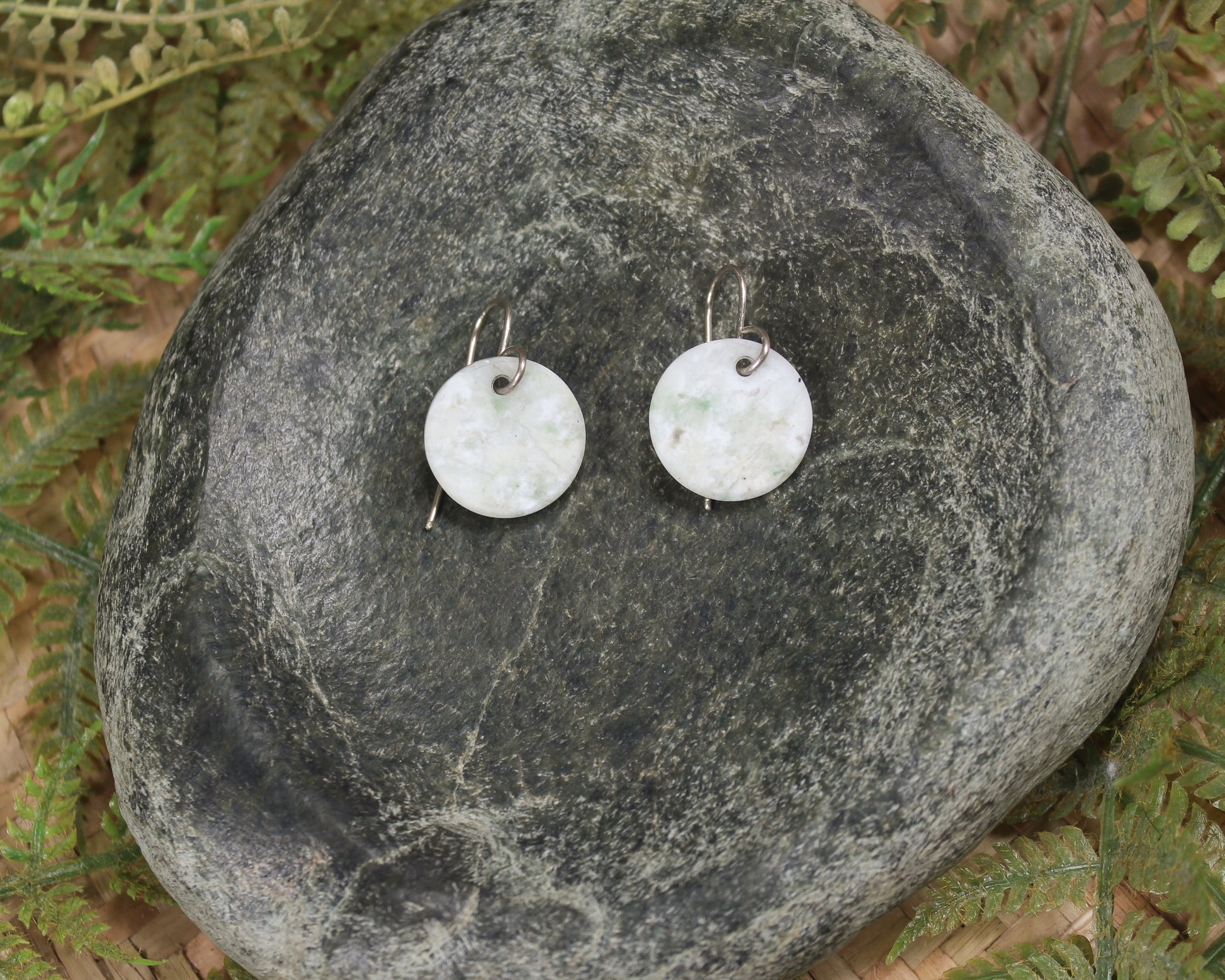 Porowhita earrings carved from Grossular Garnet