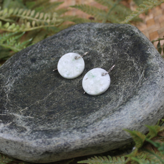 Porowhita earrings carved from Grossular Garnet