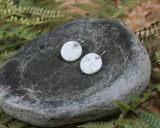 Porowhita earrings carved from Grossular Garnet