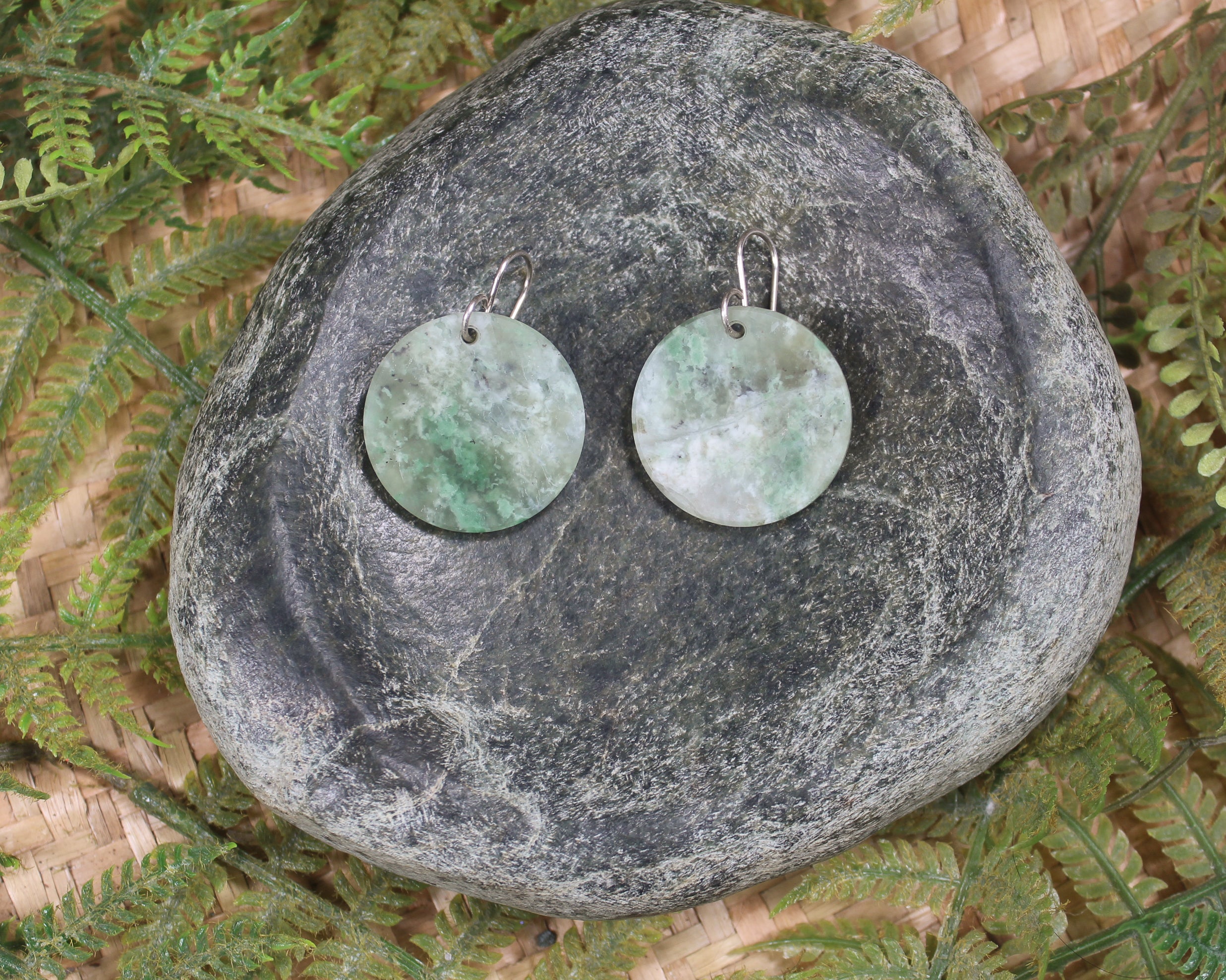 Porowhita earrings carved from Grossular Garnet
