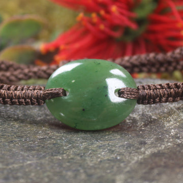 Adjustable cord bracelet with Kawakawa Pounamu