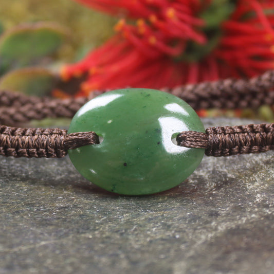 Adjustable cord bracelet with Kawakawa Pounamu