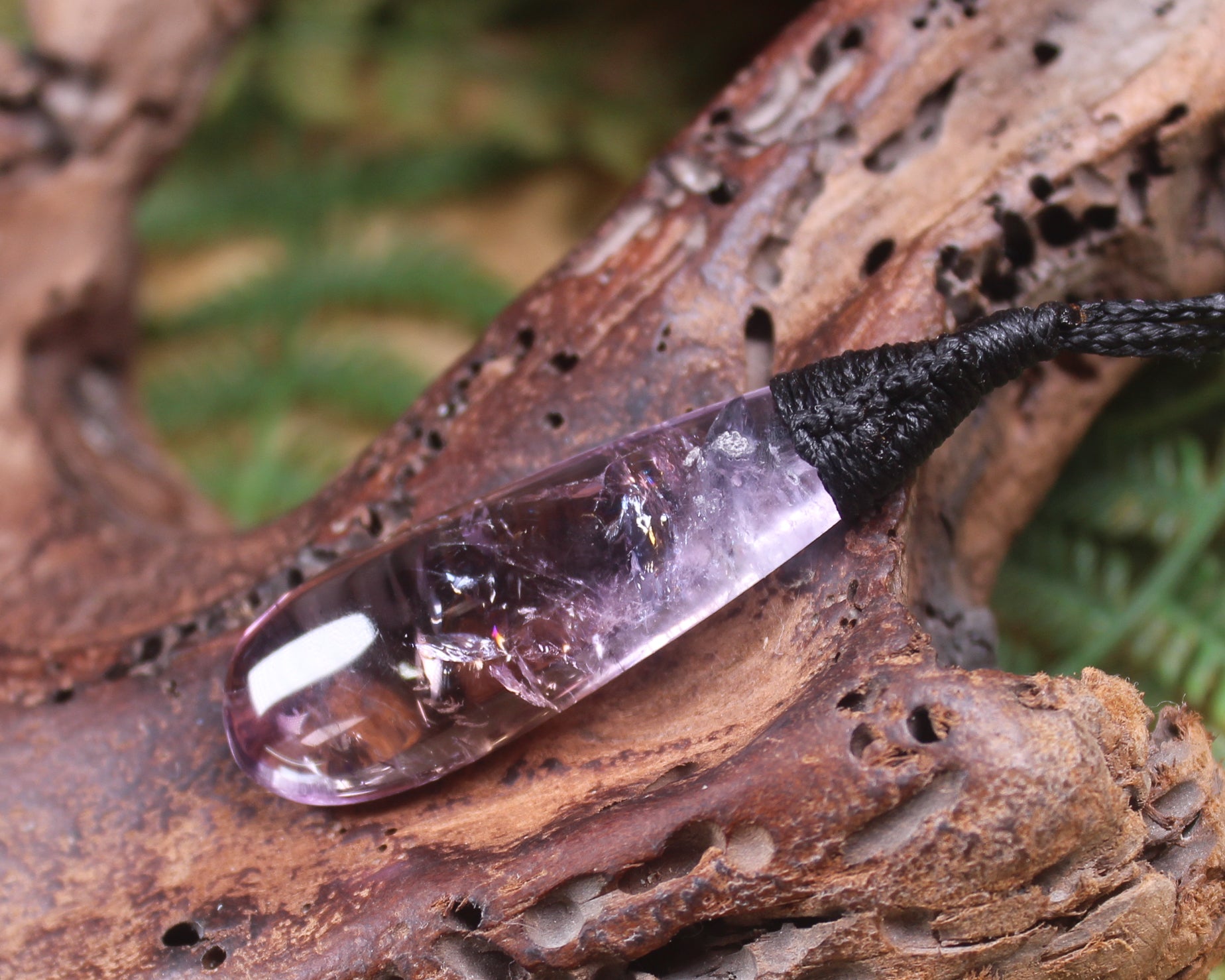 Roimata pendant carved from Amethyst