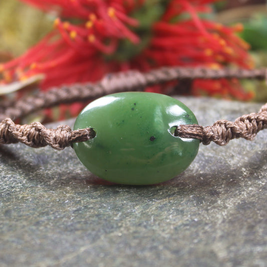 Adjustable cord bracelet with Kawakawa Pounamu