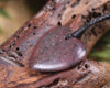 Heart carved from Rhodonite 