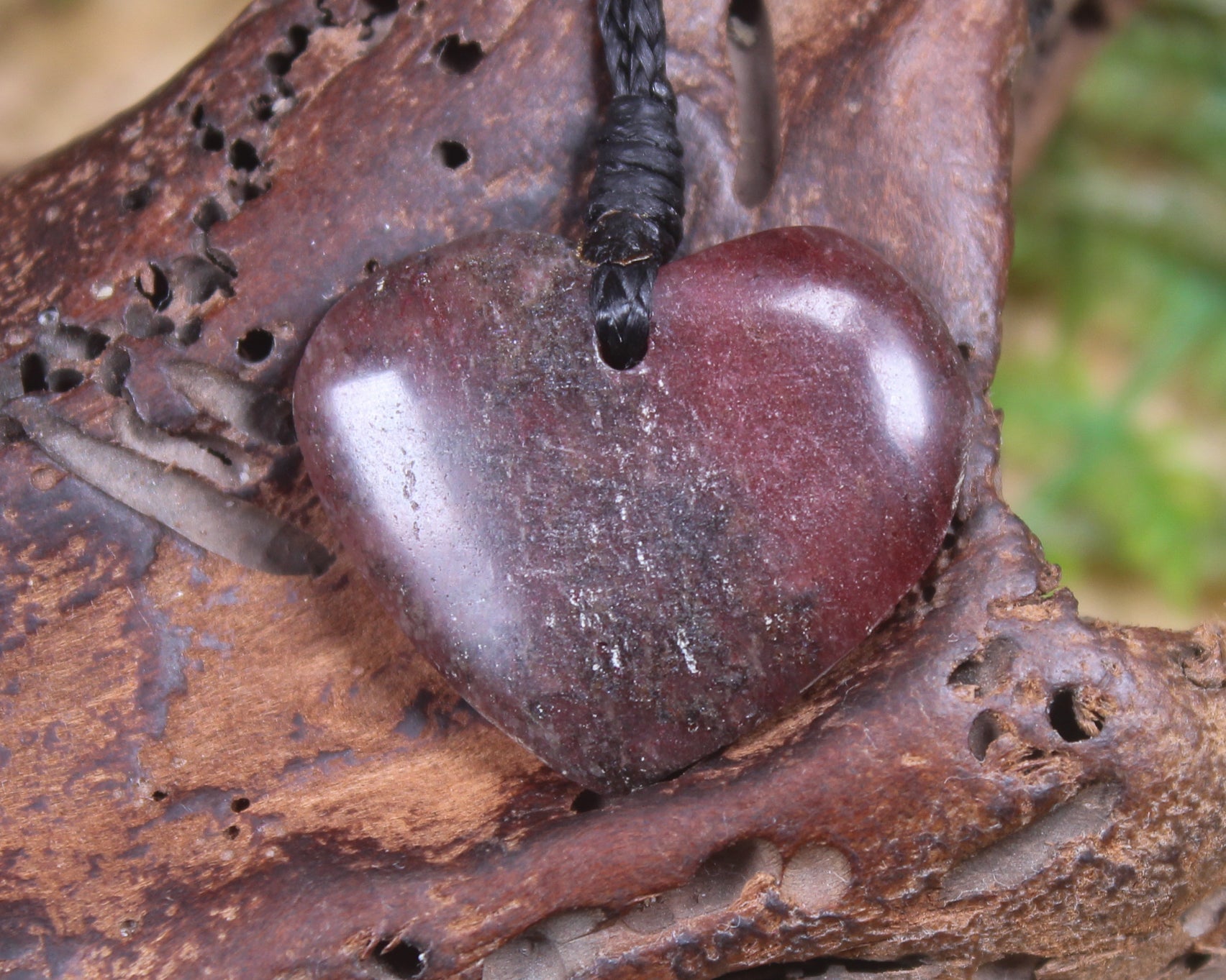 Heart carved from Rhodonite 