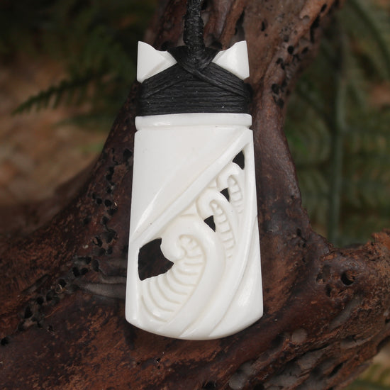 Toki or Adze with Koru carved from Beef Bone