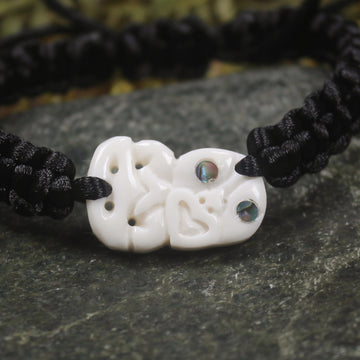 Adjustable cord bracelet with bone pendant