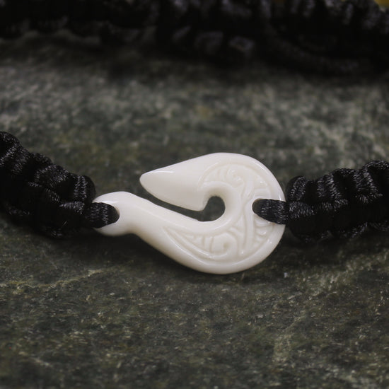 Adjustable cord bracelet with bone pendant