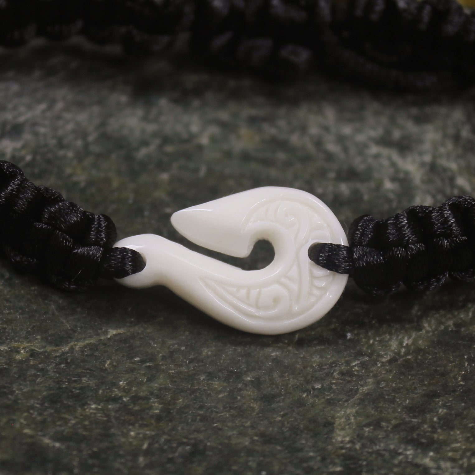 Adjustable cord bracelet with bone pendant