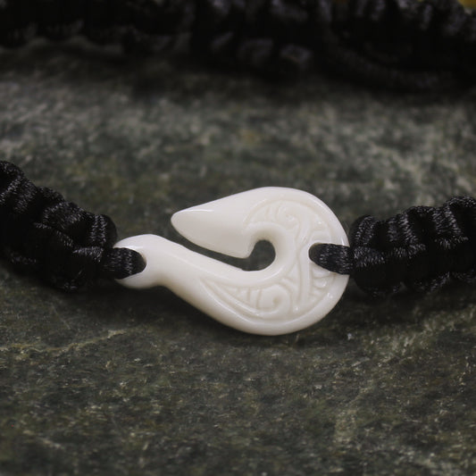 Adjustable cord bracelet with bone pendant