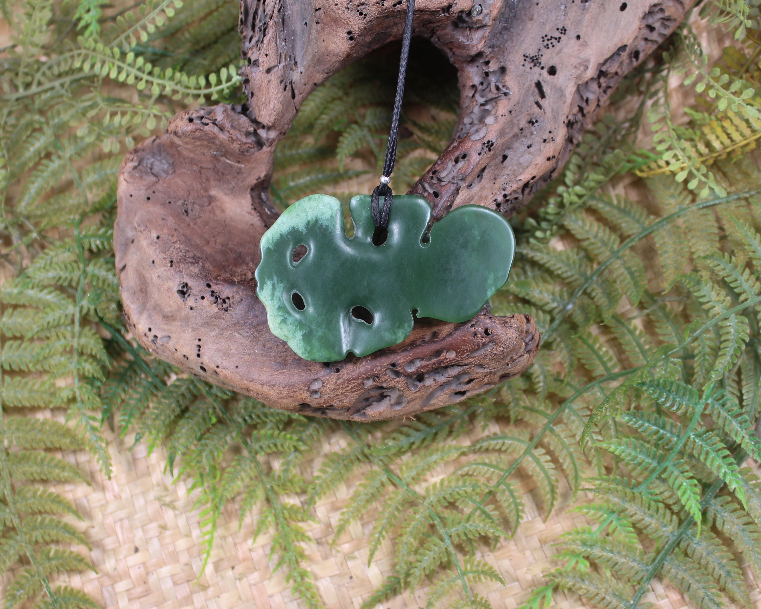 Hei Tiki carved from Flower Jade Pounamu - NZ Greenstone