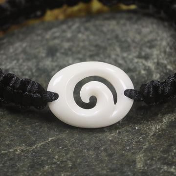 Adjustable cord bracelet with bone pendant