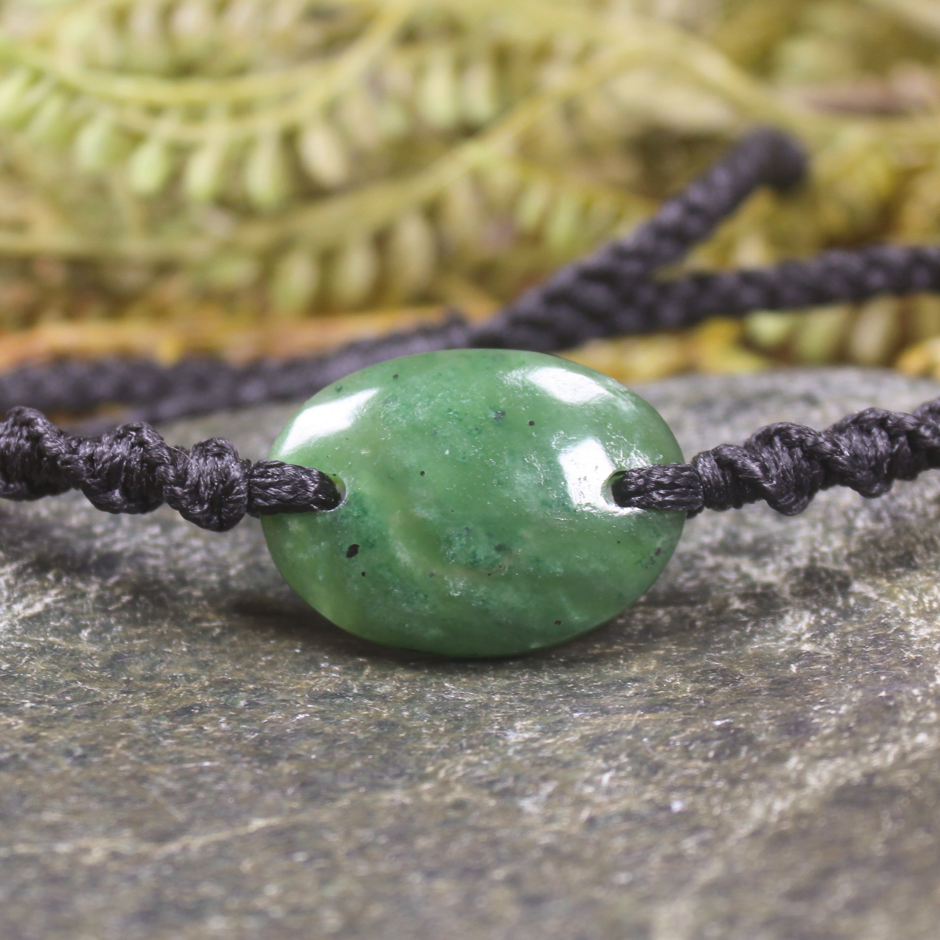 Adjustable cord bracelet with Hapopo Pounamu