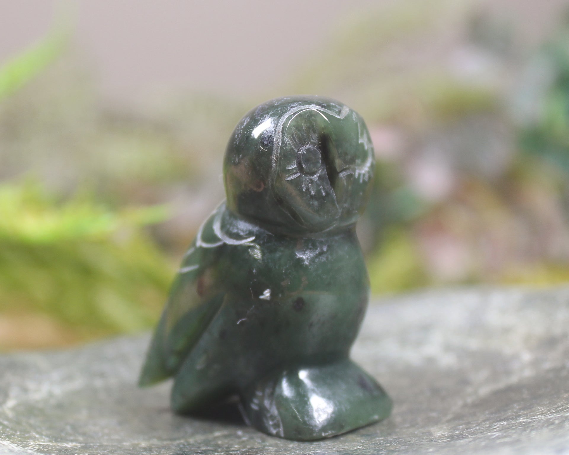 Pounamu owl sculpture