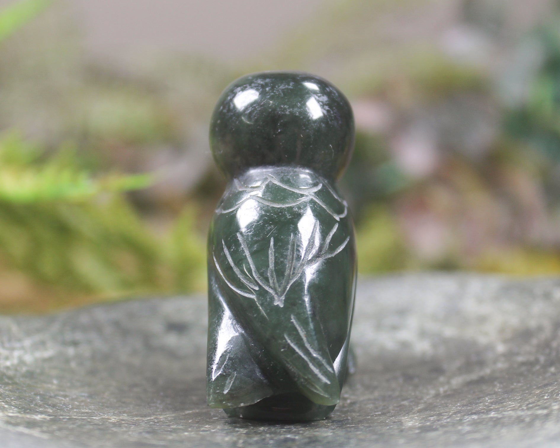 Pounamu owl sculpture