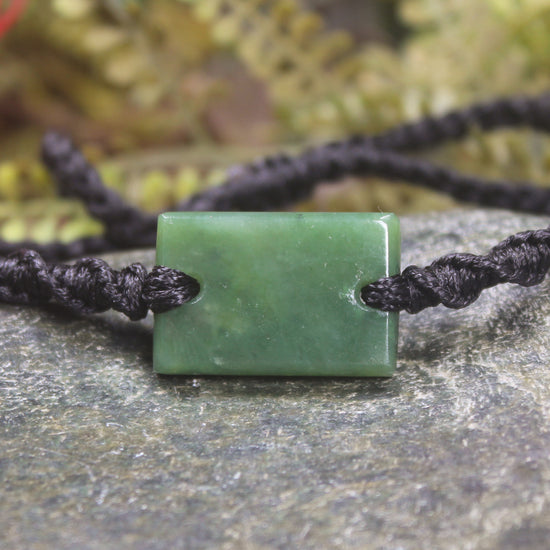 Adjustable cord bracelet with Hapopo Pounamu