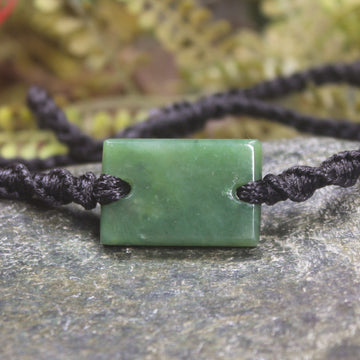 Adjustable cord bracelet with Hapopo Pounamu