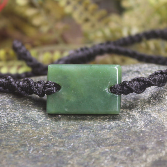 Adjustable cord bracelet with Hapopo Pounamu