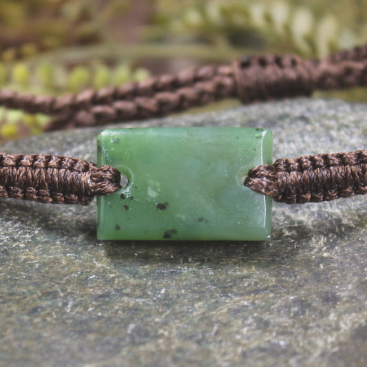 Adjustable cord bracelet with Hapopo Pounamu