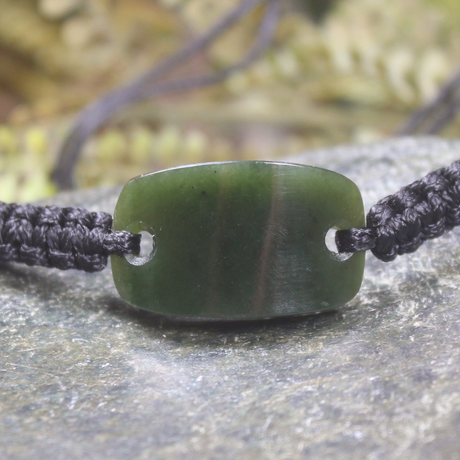 Adjustable cord bracelet with Kawakawa Pounamu