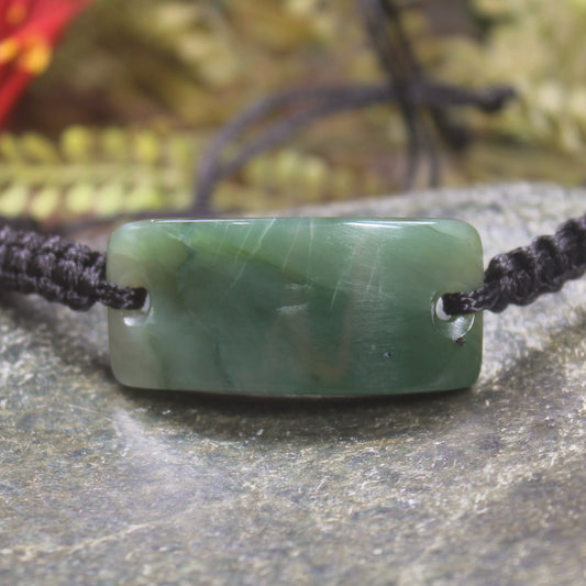 Adjustable cord bracelet with Inanga Pounamu