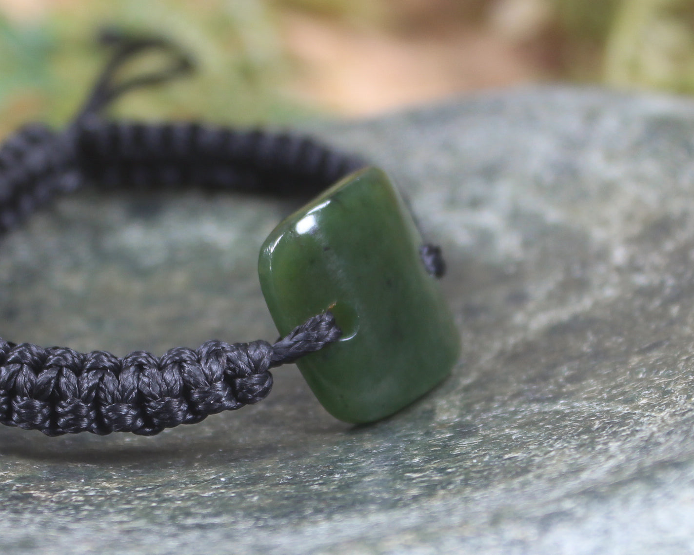 Adjustable cord bracelet with Rimu Pounamu