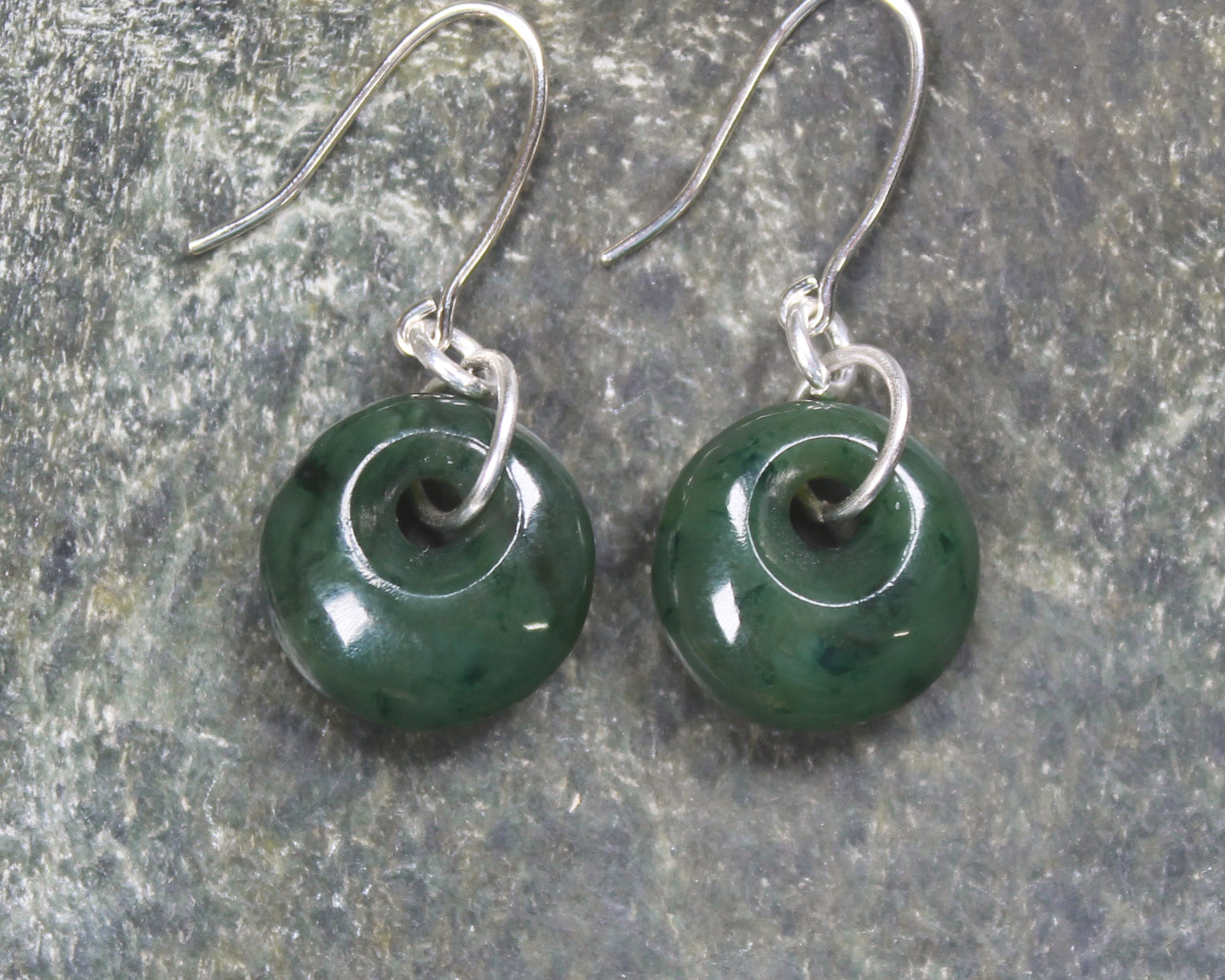 Porowhita Earrings carved from Kawakawa Pounamu - NZ Greenstone