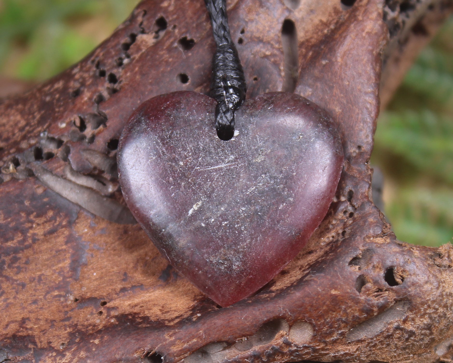 Heart carved from Rhodonite 