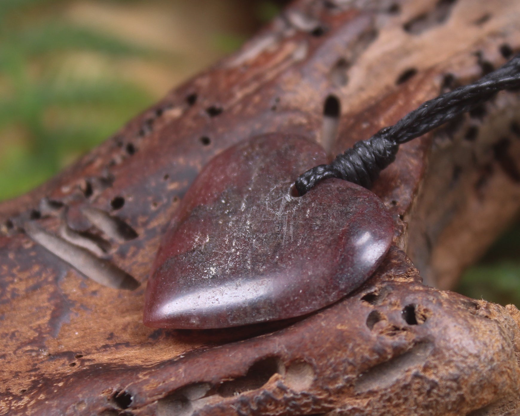 Heart carved from Rhodonite 