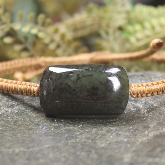 Adjustable cord bracelet with Rimu Pounamu