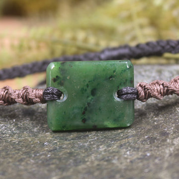 Adjustable cord bracelet with Kawakawa Pounamu