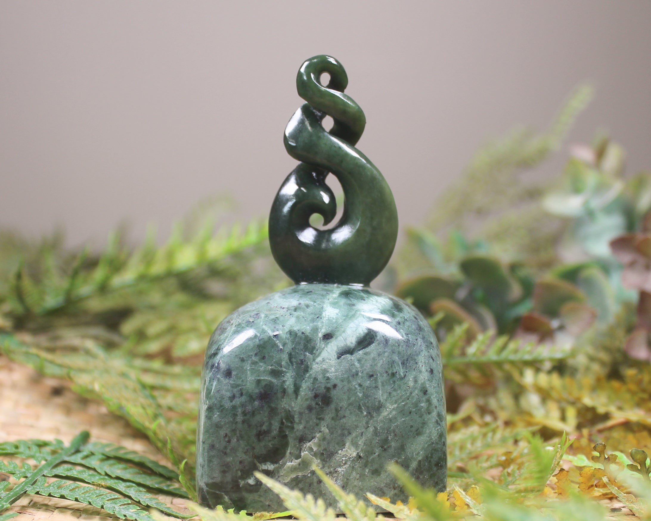 Kawakawa Pounamu Koru Twist set on a Pounamu base - NZ Greenstone