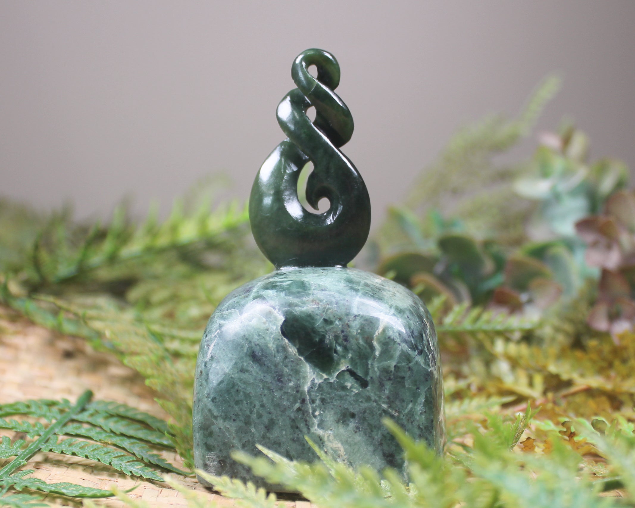 Kawakawa Pounamu Koru Twist set on a Pounamu base - NZ Greenstone