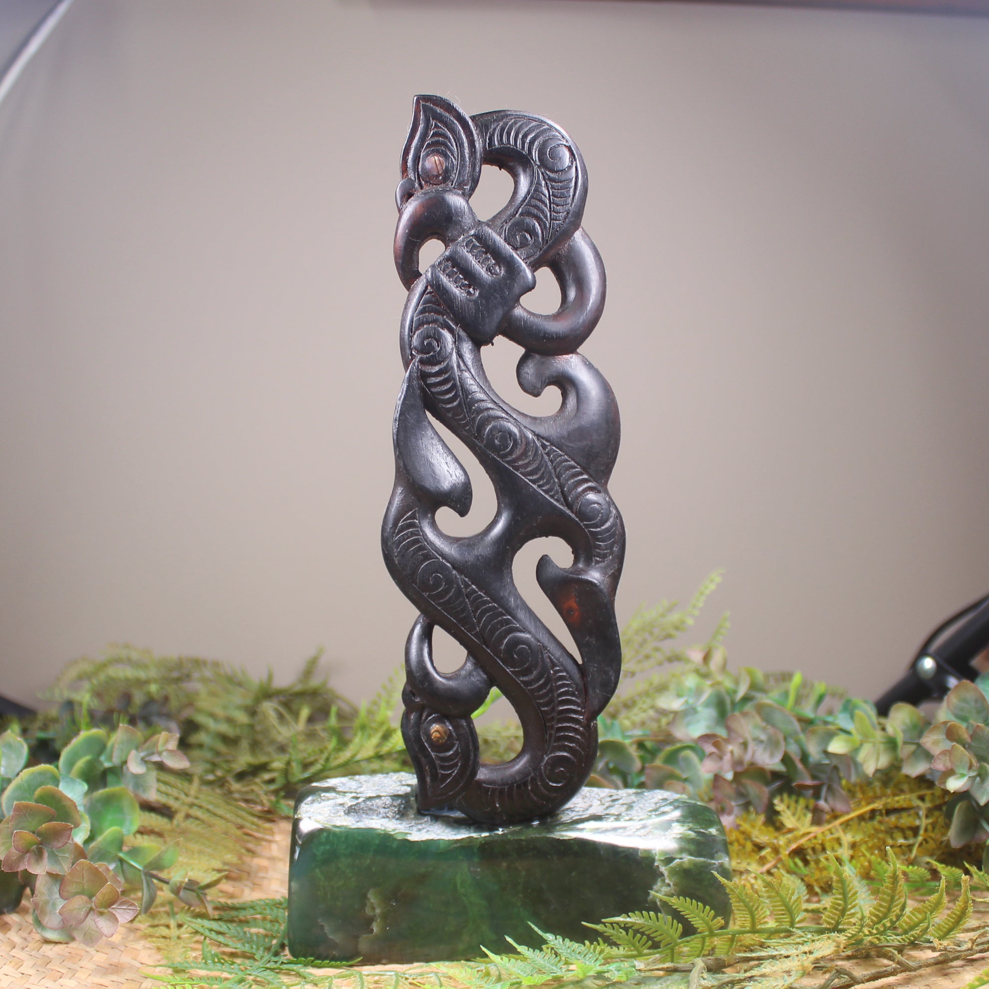 Manaia sculpture carved from recycled wood