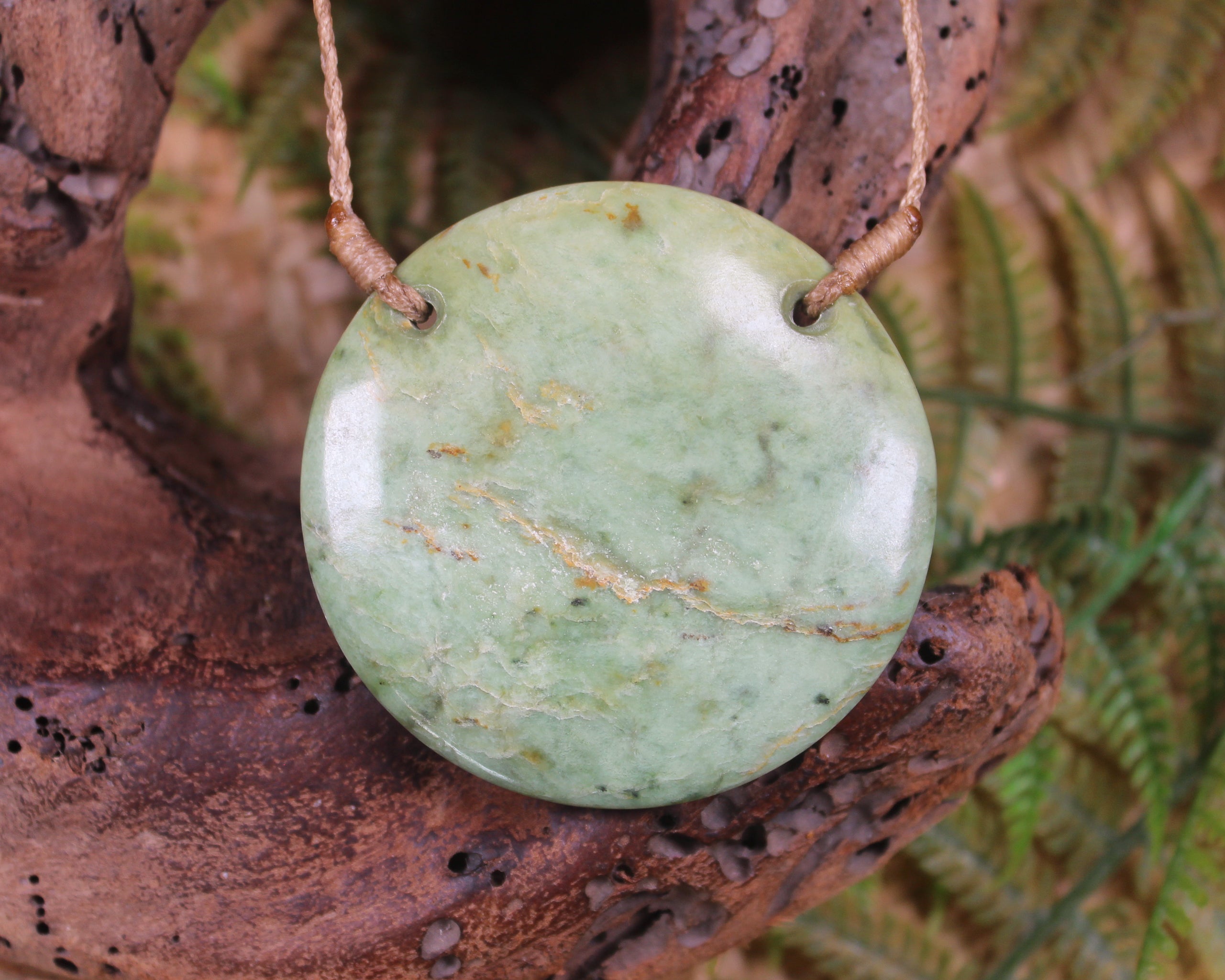 Porowhita carved from Flower Jade Pounamu - NZ Greenstone