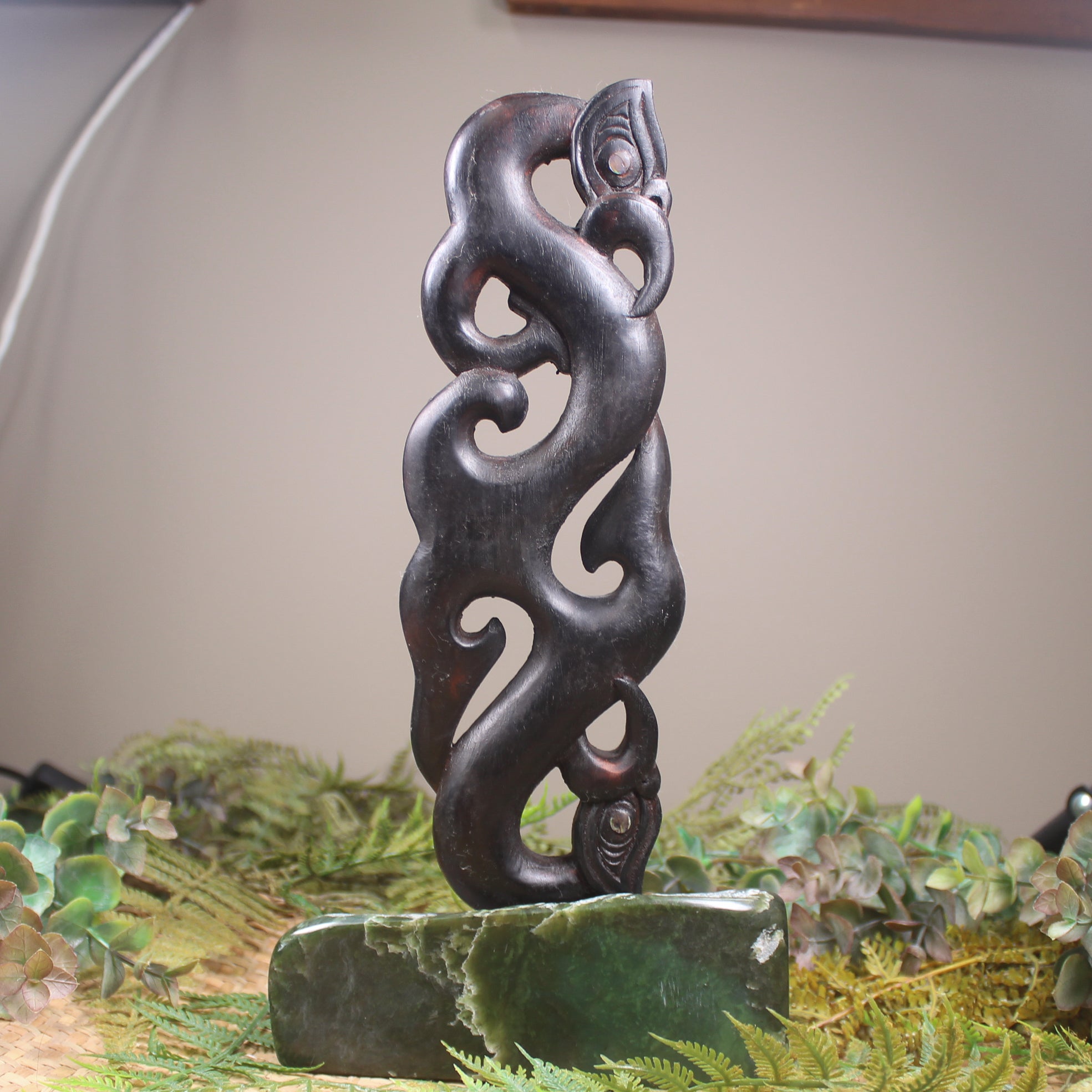 Manaia sculpture carved from recycled wood