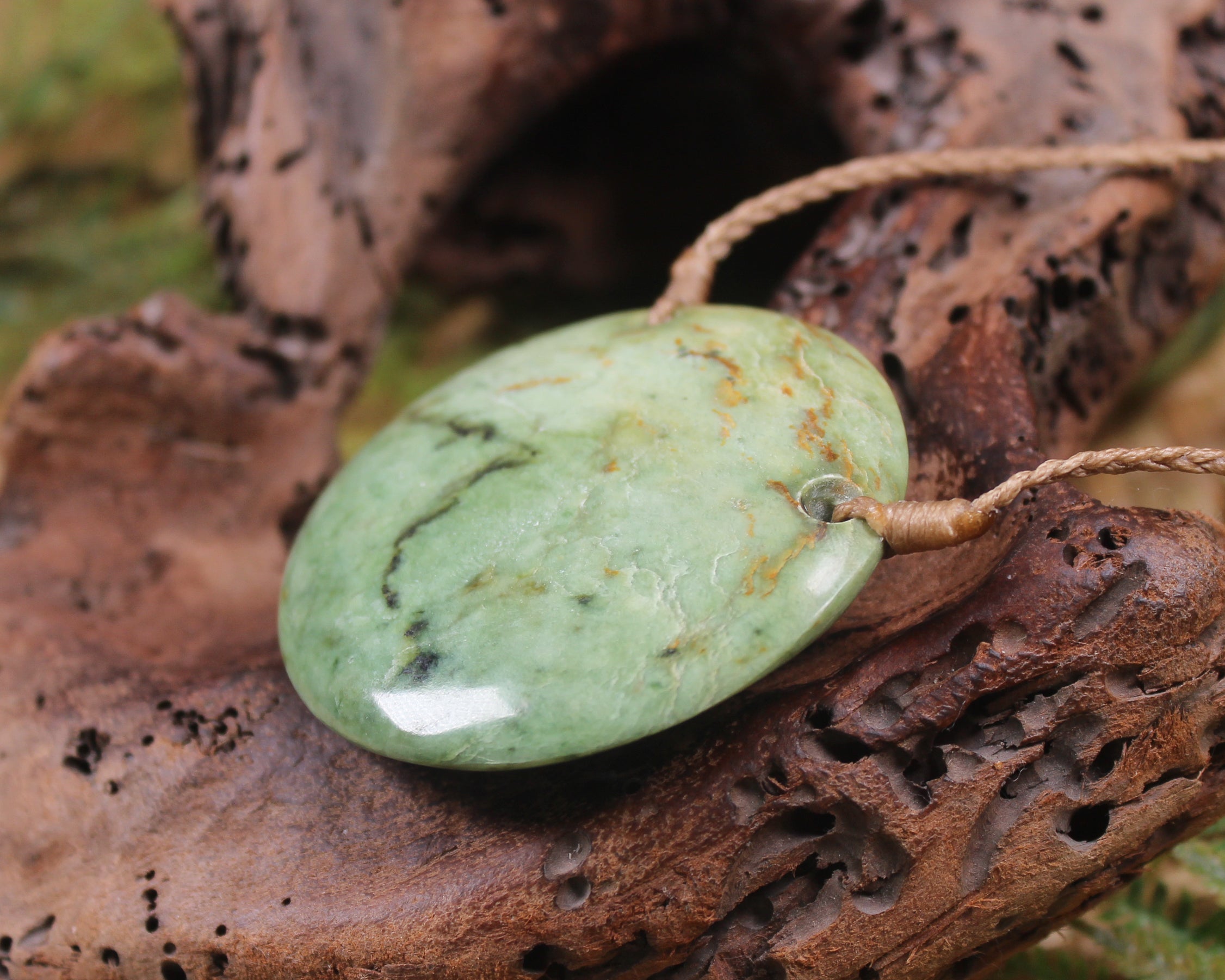 Porowhita carved from Flower Jade Pounamu - NZ Greenstone