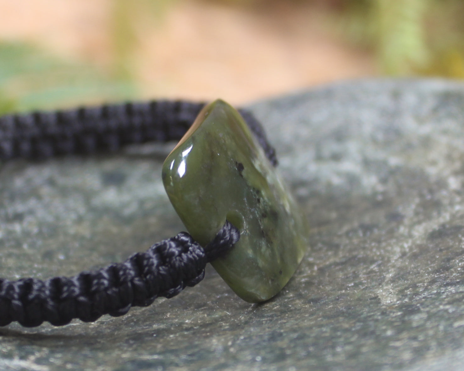 Adjustable cord bracelet with Rimu Pounamu