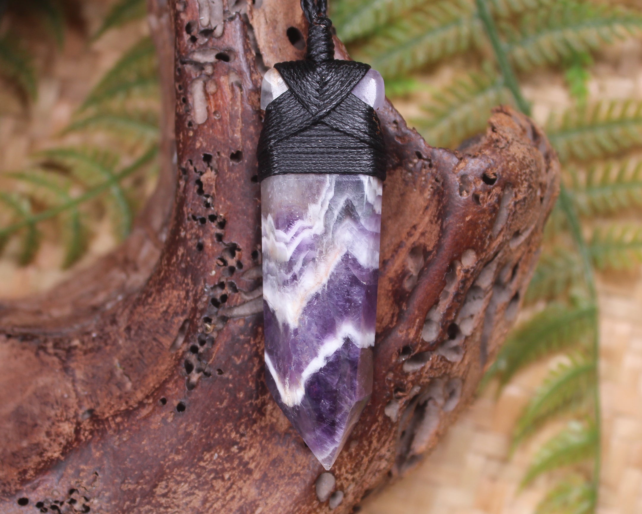 Pointed pendant carved from Chevron Amethyst