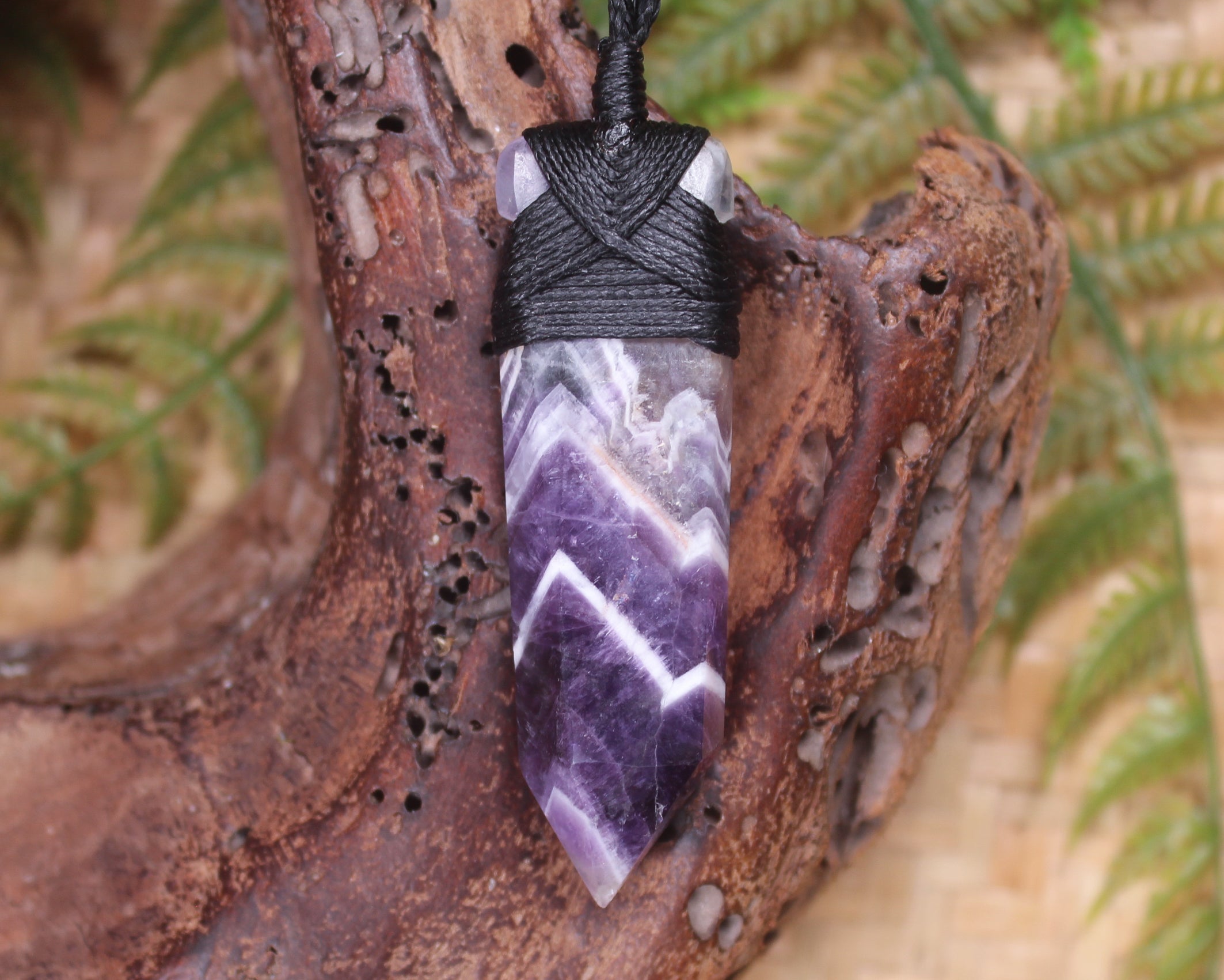 Pointed pendant carved from Chevron Amethyst