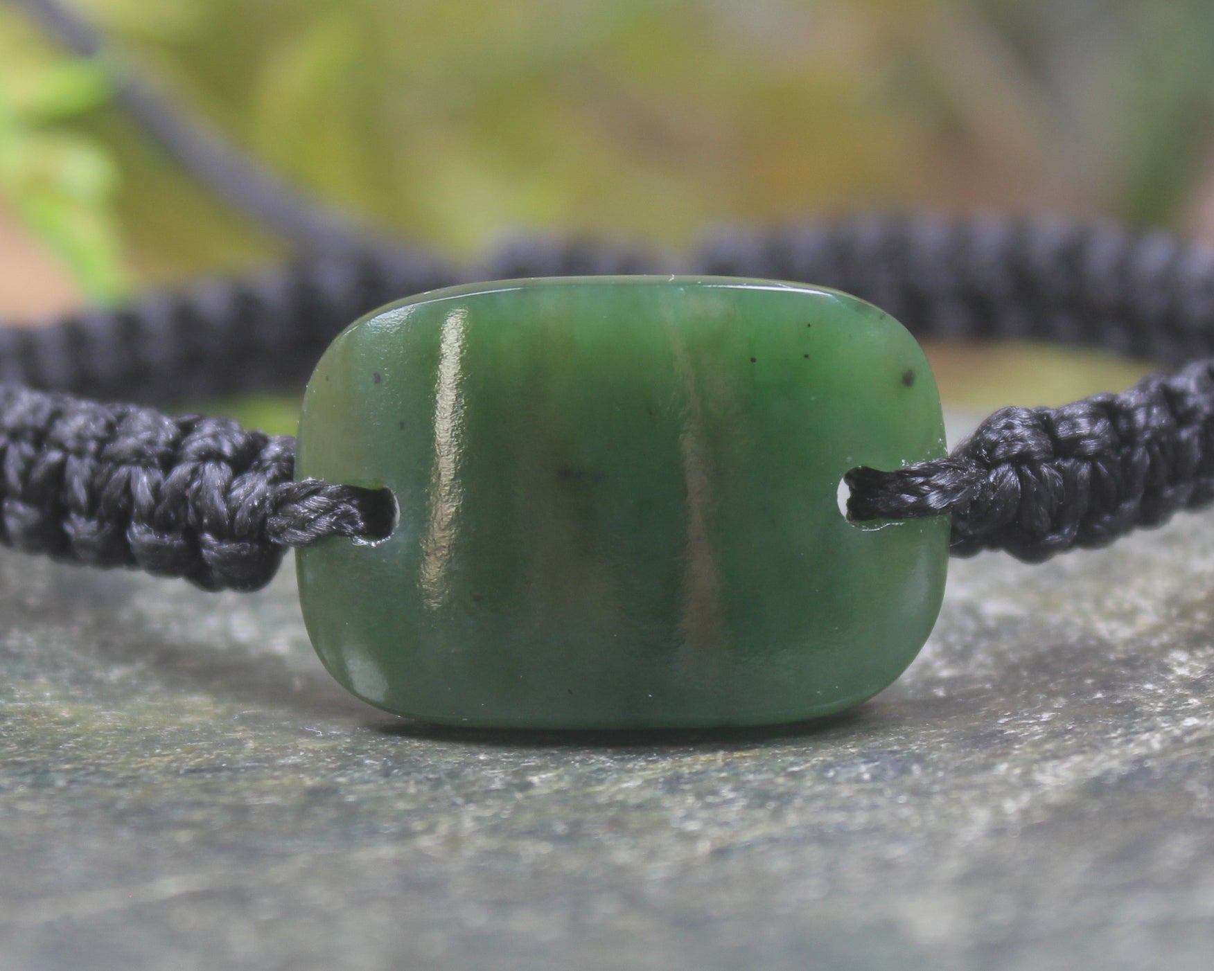 Adjustable cord bracelet with Kawakawa Pounamu