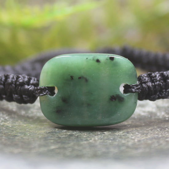 Adjustable cord bracelet with Hapopo Pounamu