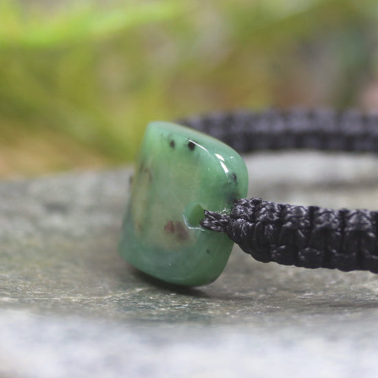 Adjustable cord bracelet with Hapopo Pounamu