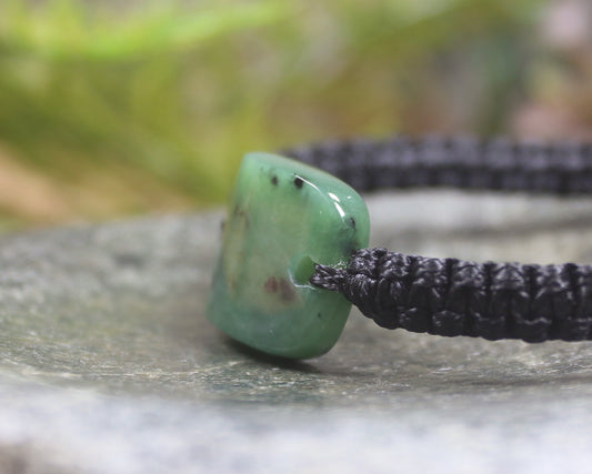Adjustable cord bracelet with Hapopo Pounamu