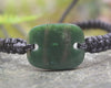 Adjustable cord bracelet with Kawakawa Pounamu