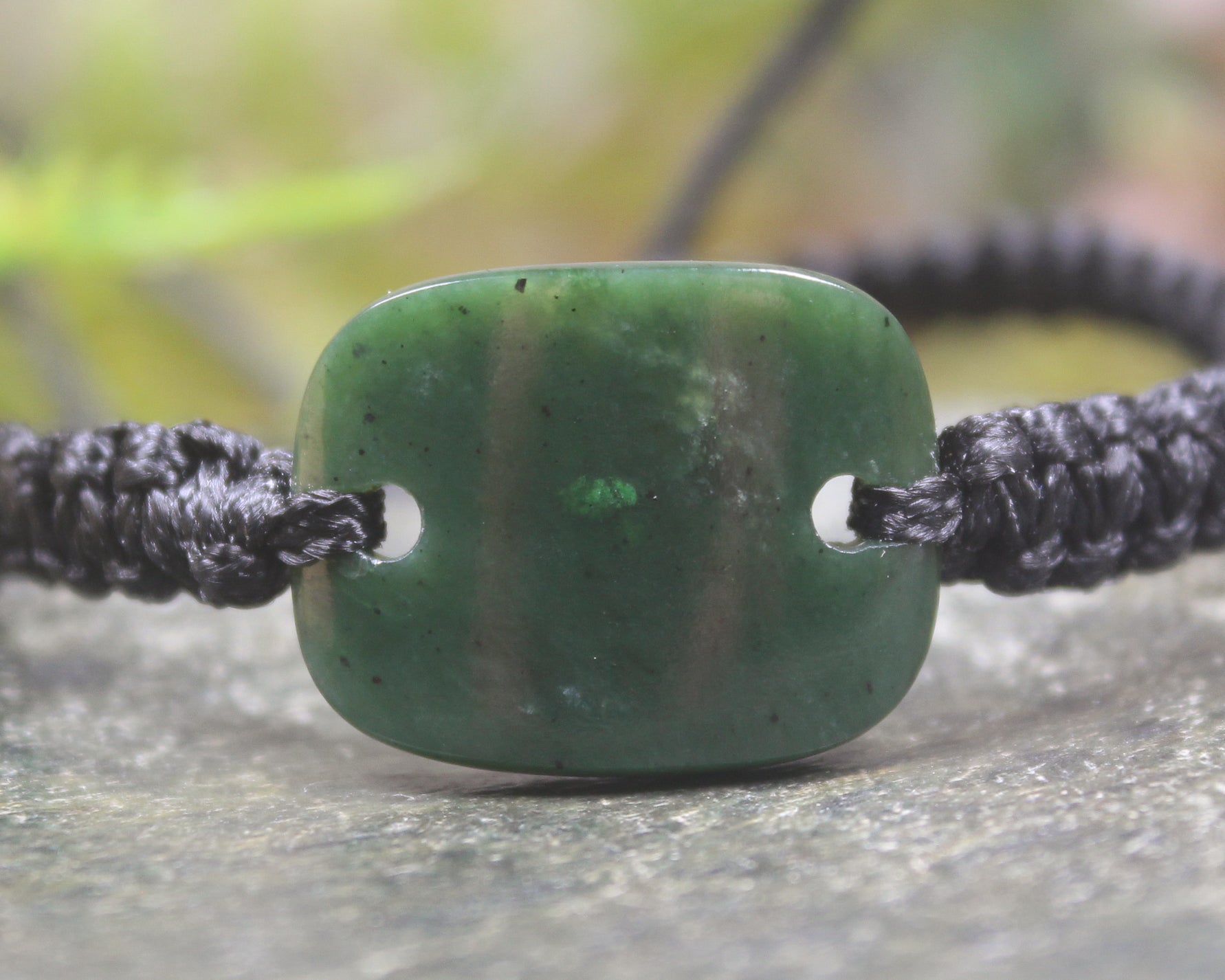 Adjustable cord bracelet with Kawakawa Pounamu